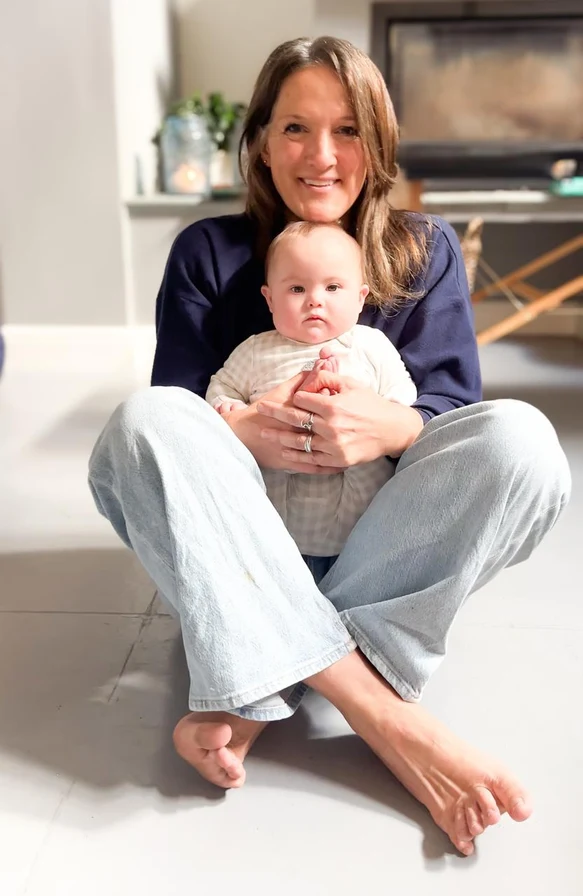 A mother holding her baby